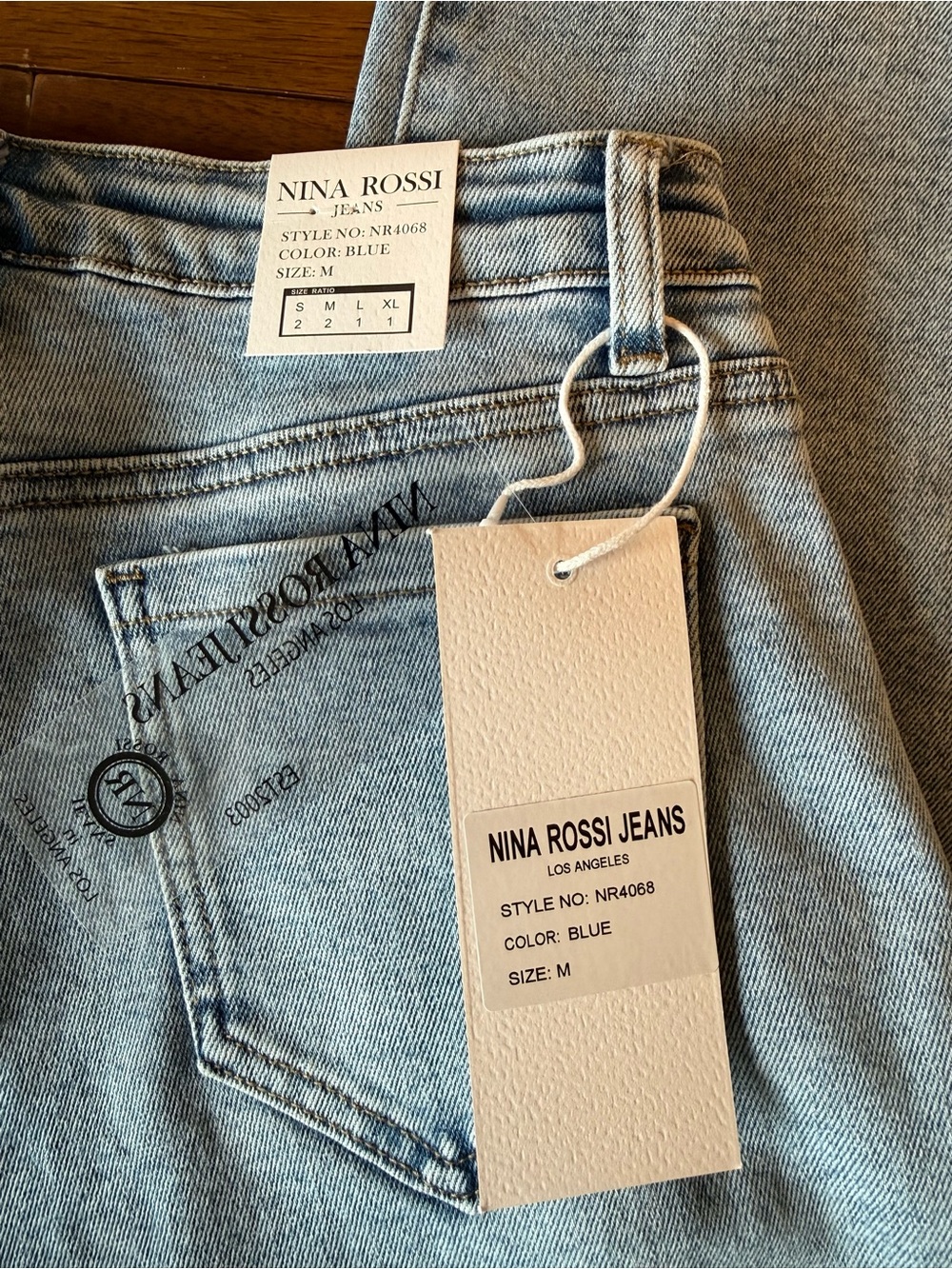 High-Rise Light Blue Wide-Leg Jeans with Side Button Detail - Picture 12 of 16
